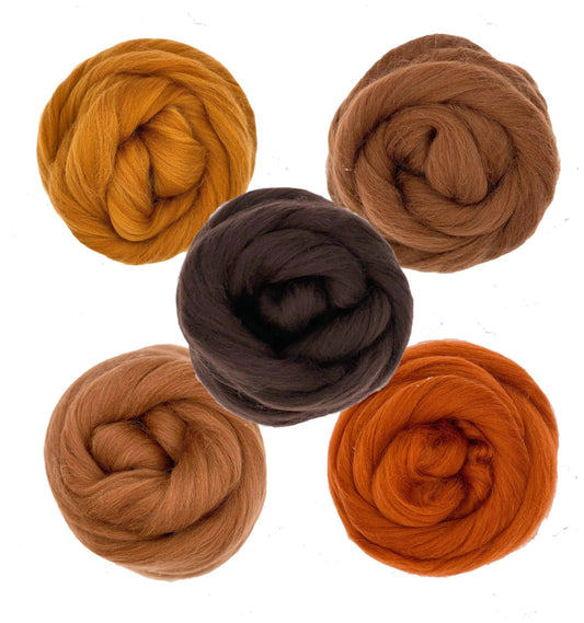 Five balls of brown and orange yarn on a white background