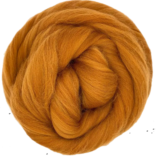 Ball of orange yarn on a white background