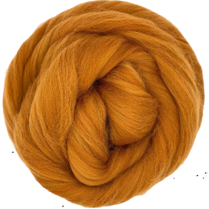 Ball of orange yarn on a white background