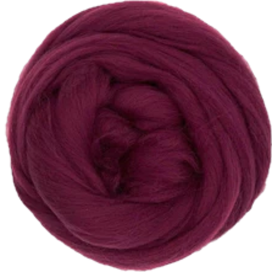 Ball of dark red yarn on a white background