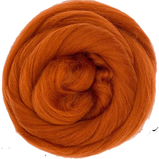 Ball of orange yarn on a white background